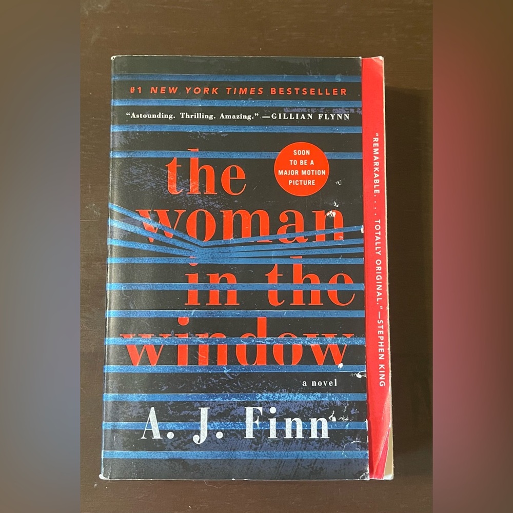The Woman in the Window book by A. J. Finn.